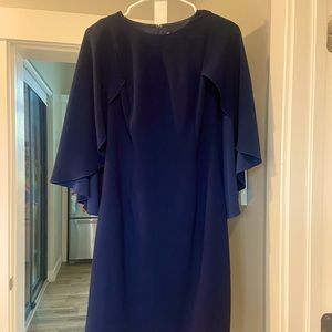 Beautiful Navy Trina Turk knee length dress with a cape accent style